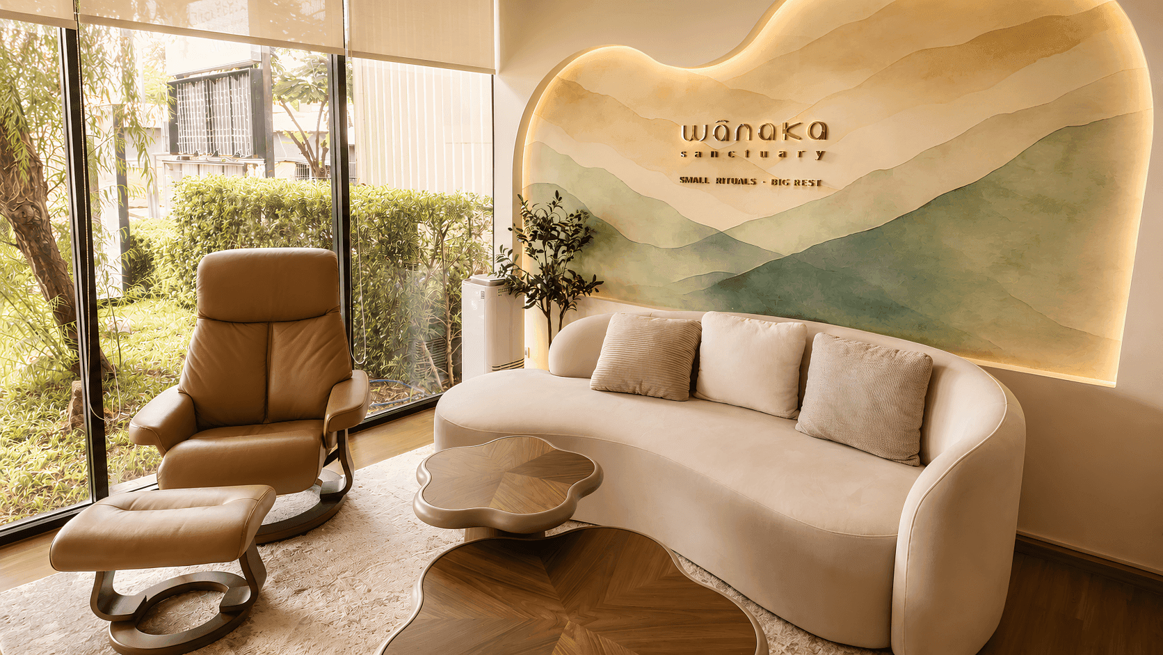 VIP lounge sofa beneath the WANAKA mural wall