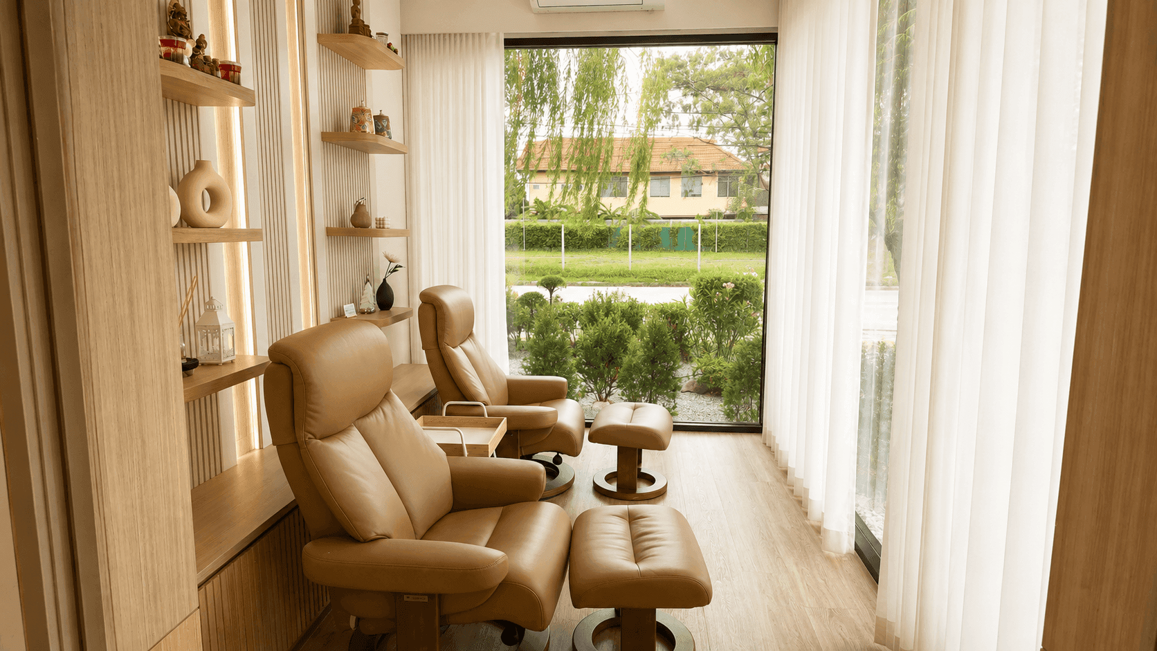 VIP relaxation room with reclining chairs facing the garden